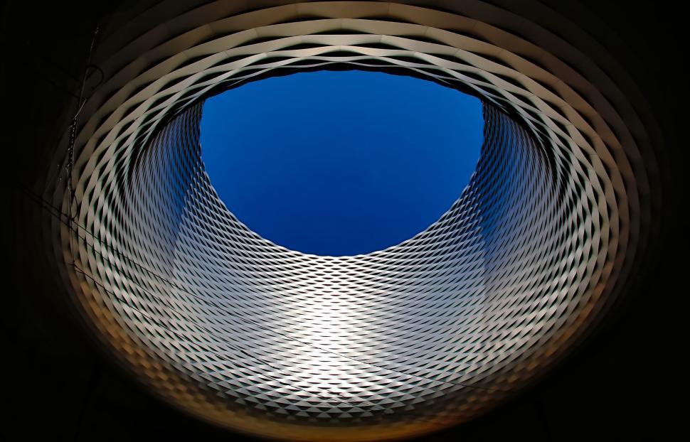 Free Image of Circular architectural structure with a blue sky view. 