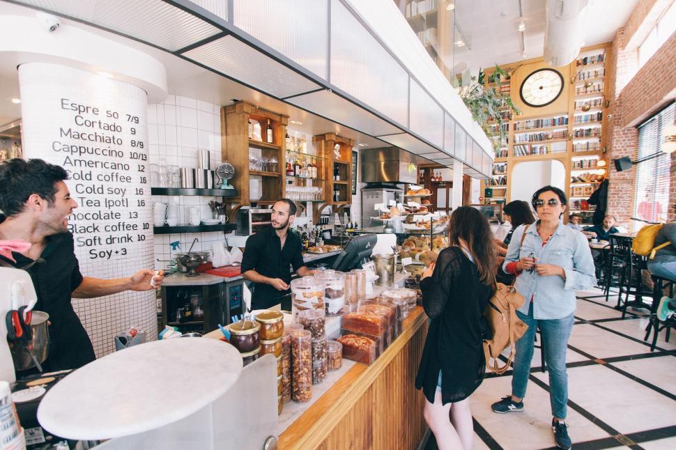 Free Image of Modern cafe with barista and customers in bright interior 