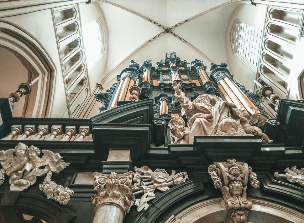 Free Image of Intricately designed cathedral interior with grand organ. 