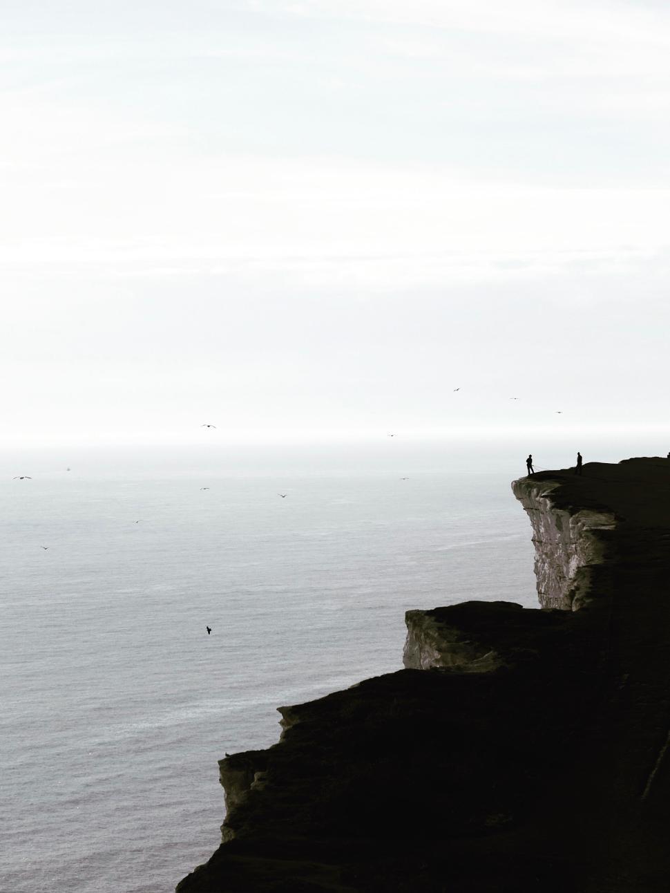 Free Image of Cliffside view overlooking the expansive ocean horizon. 