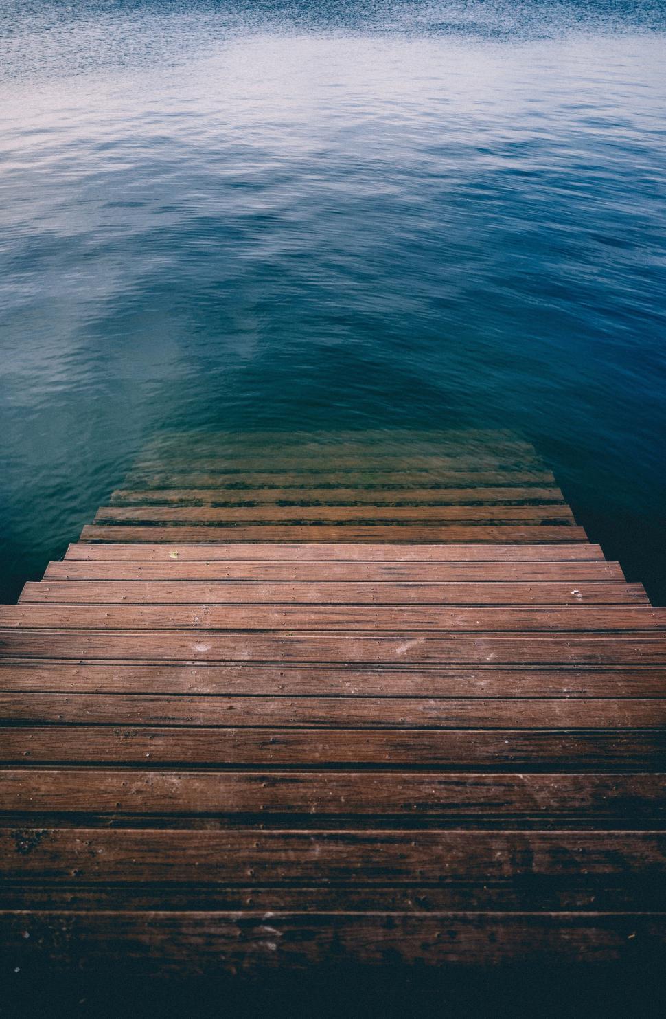 Free Stock Photo of Wooden steps descending into calm and serene waters ...