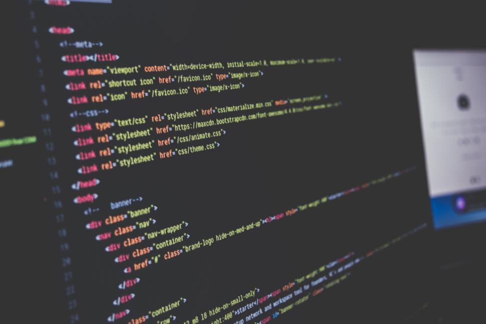 Free Image of Close-up of computer code on a dark screen interface. 