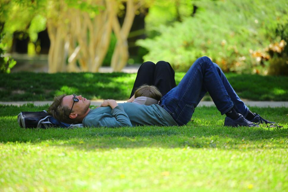https://freerangestock.com/sample/182345/two-people-relaxing-on-green-grass-in-a-sunny-park..jpg