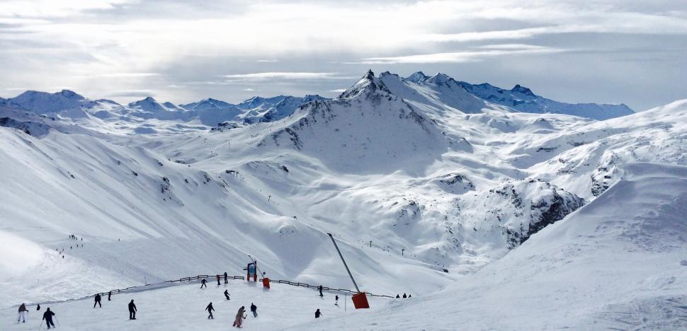 Free Image of Skiers enjoying snow-covered mountainous landscape 
