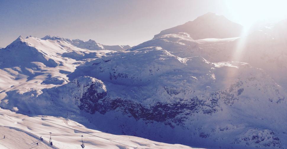Free Image of Snow-capped mountains under the bright sunlight. 