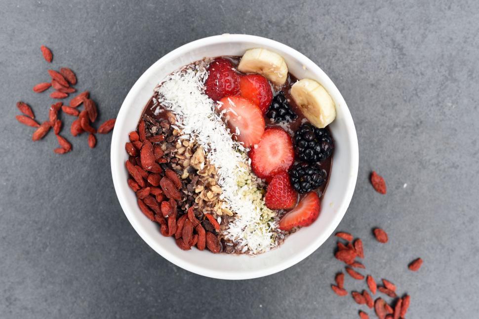 Free Image of Smoothie bowl topped with fresh fruit and seeds 