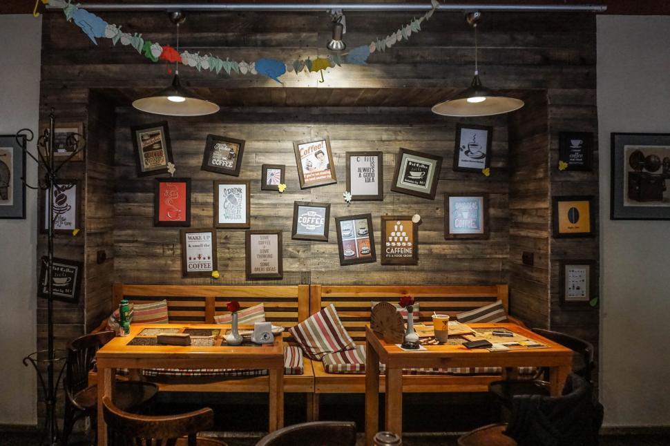 Free Image of Warm cozy coffee shop corner with wooden furniture. 