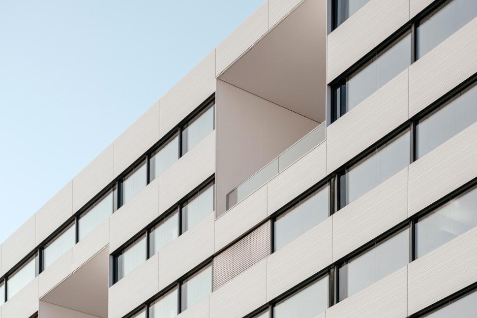 Free Image of Modern minimalist building with grid-like windows design 