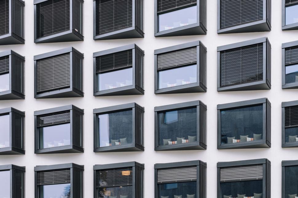 Free Image of Modern building facade with square windows and shades 