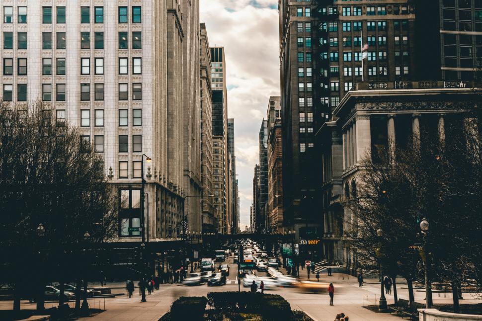 Free Image of Busy city street lined with tall buildings, urban city 