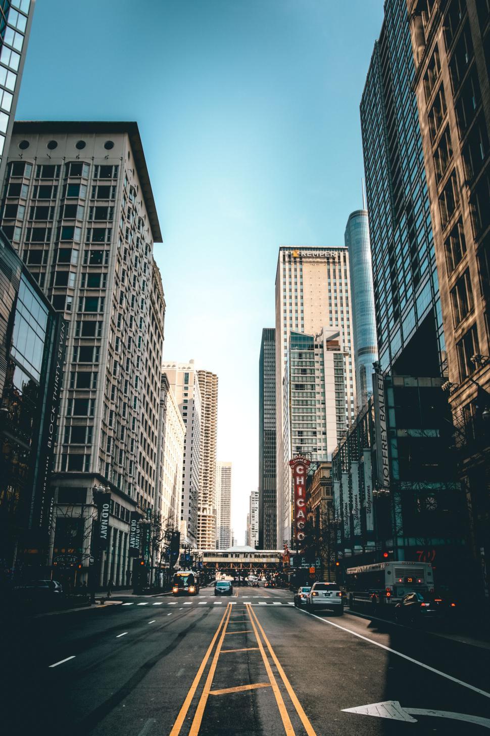 Free Image of Bustling downtown city street with theater sign 