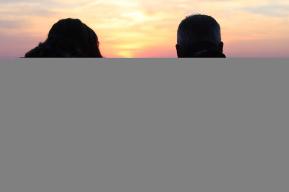 a-couple-watching-sunset-from-a-high-vantage-point..jpg
