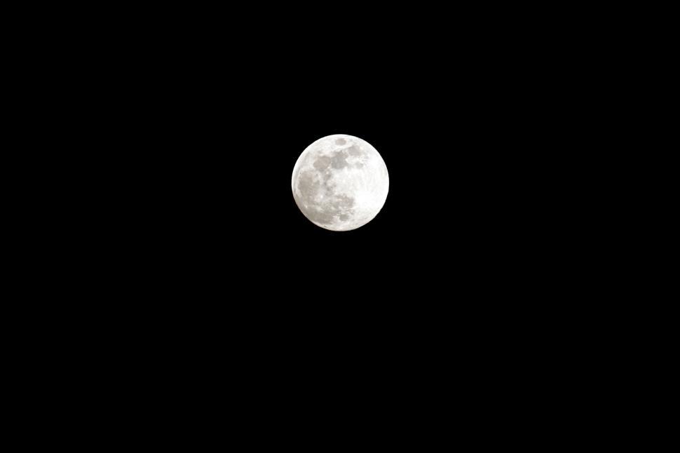 Free Image of Full moon shining brightly in clear night sky 