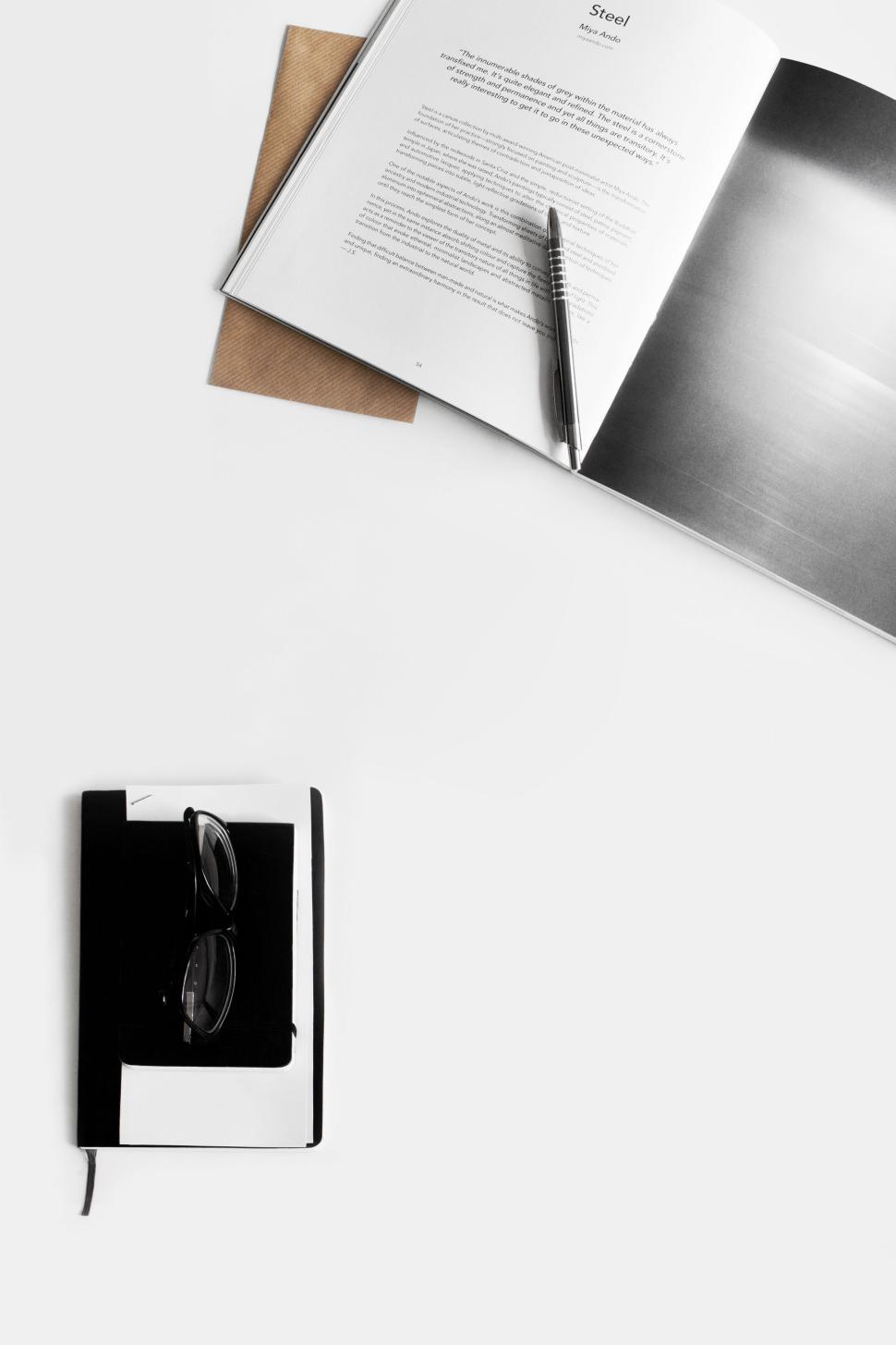 Free Image of Open book and pen on white table with notebook 