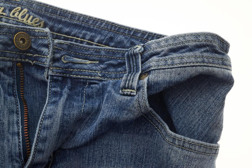 Free Image of Close-up of blue denim jeans with button and zipper detail. 