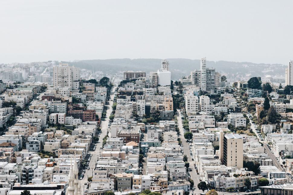 Free Image of High-angle view of a city with numerous white buildings. 