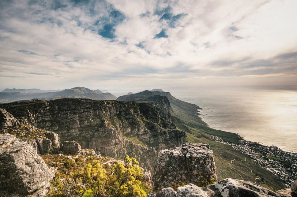 Free Image of Scenic landscape view of mountain range by the sea 