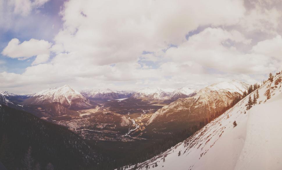 Free Image of Scenic landscape of snowy mountainous valley with river 