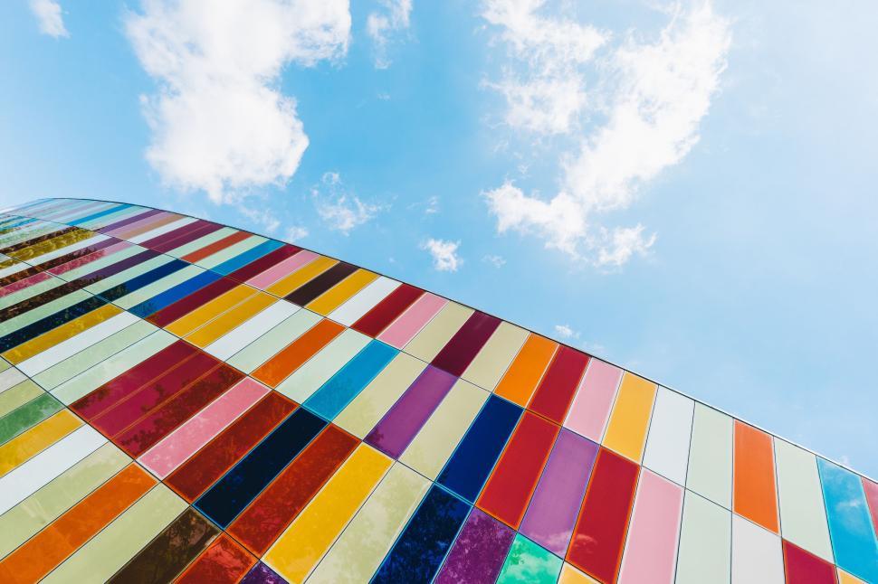 Free Image of Colorful glass facade of modern architecture under sky 