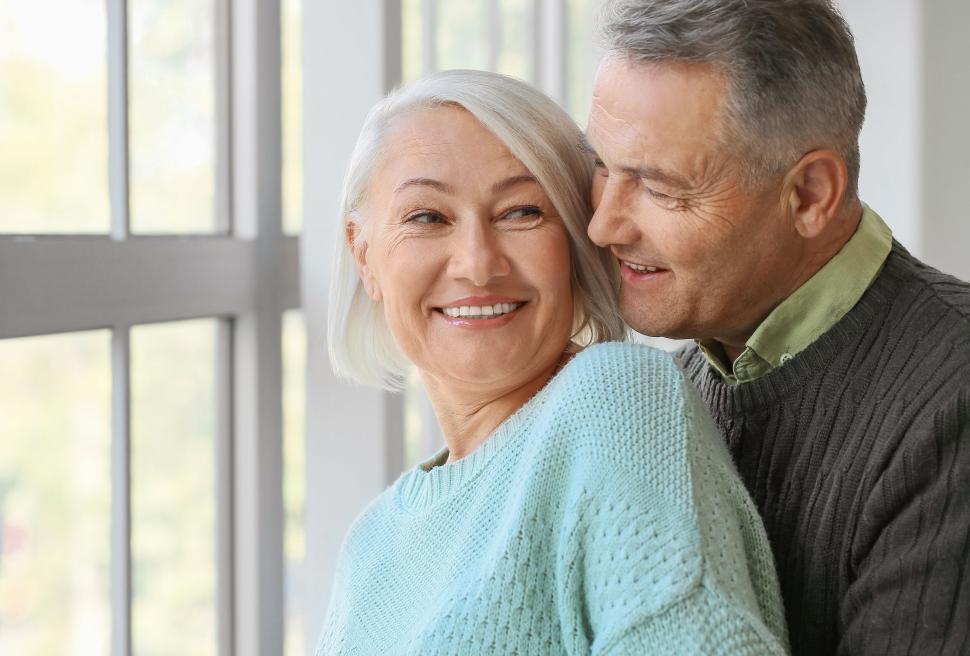 Free Image of Older man lovingly close to a smiling older woman 