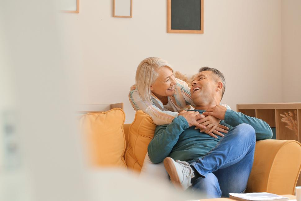 Free Image of Couple Relaxing on the Couch in a Cozy Home Setting 