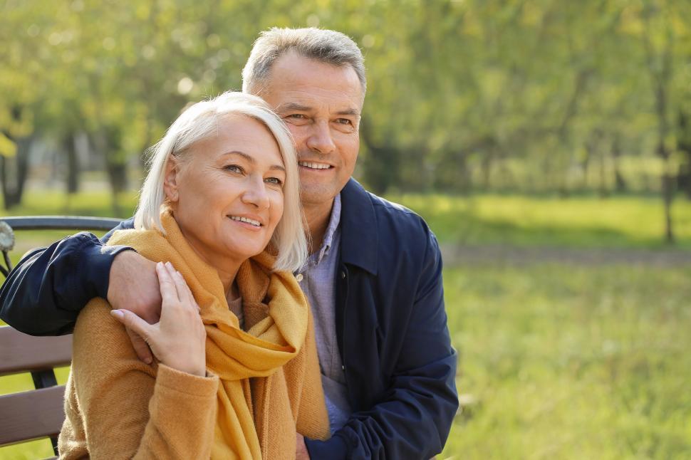 Free Image of Loving couple enjoying each other s company on park bench. 