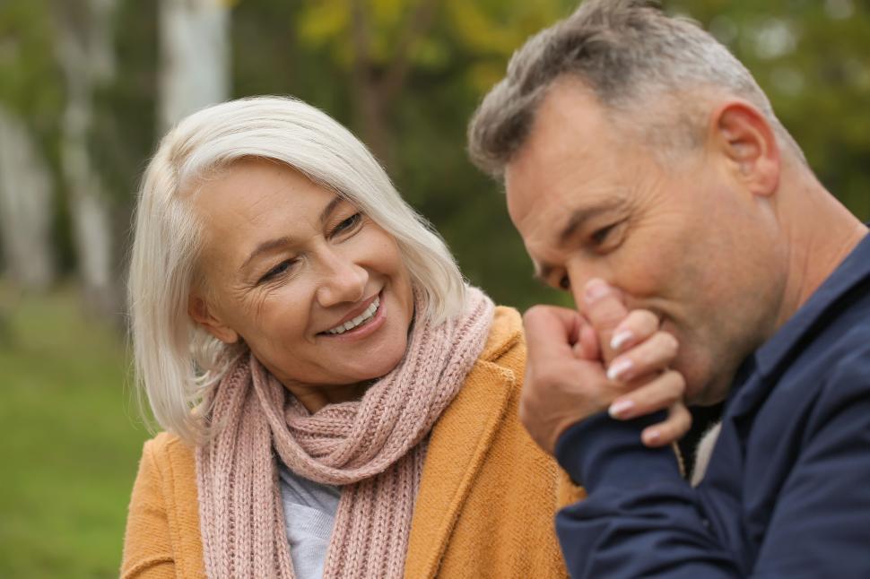 Free Image of Senior couple enjoying a tender outdoor moment together 