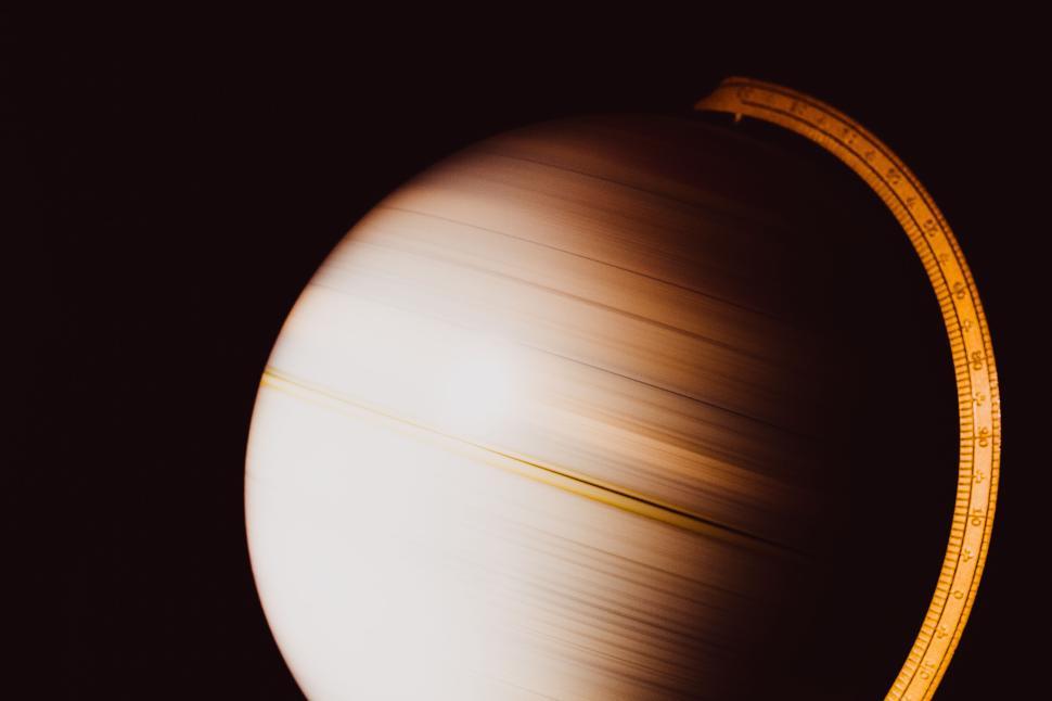 Free Image of Spinning globe on dark background with measure tool 
