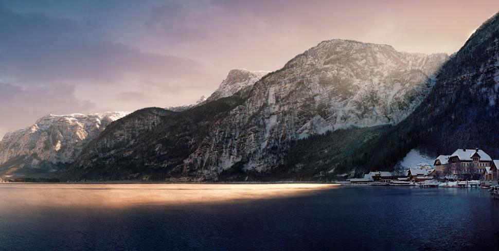 Free Image of Mountain landscape with a calm lake and sunset light. 