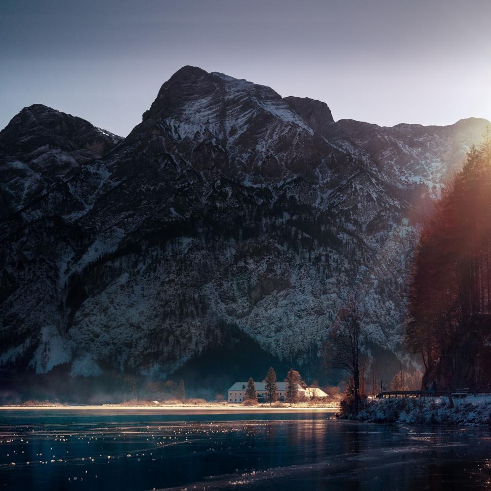 Free Image of Mountain landscape with lake and morning sunlight rays view. 