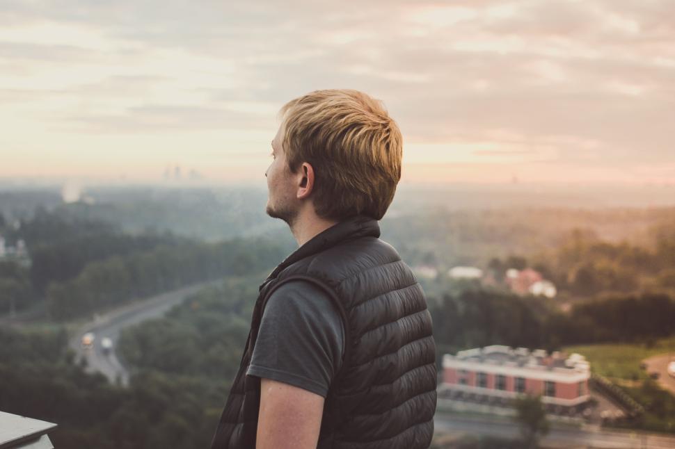Free Image of Person standing on balcony overlooking city landscape 