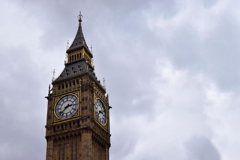 Free Image of Close-up of Big Ben clock tower against cloudy sky. 