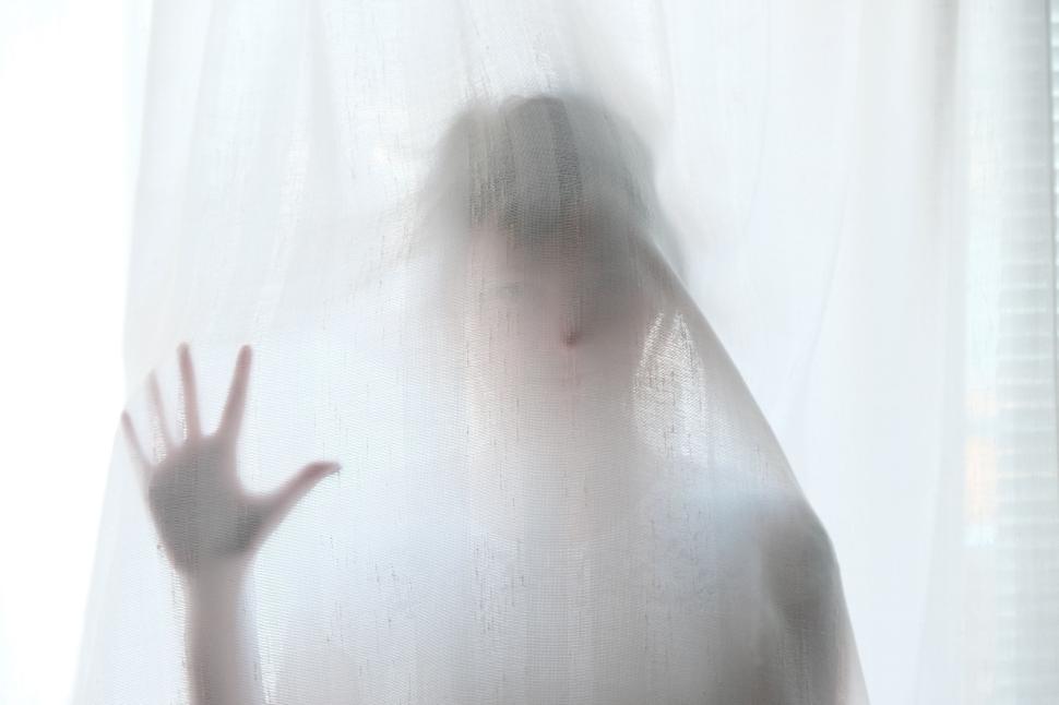 Free Image of Hand pressing against white translucent curtain sunlight 