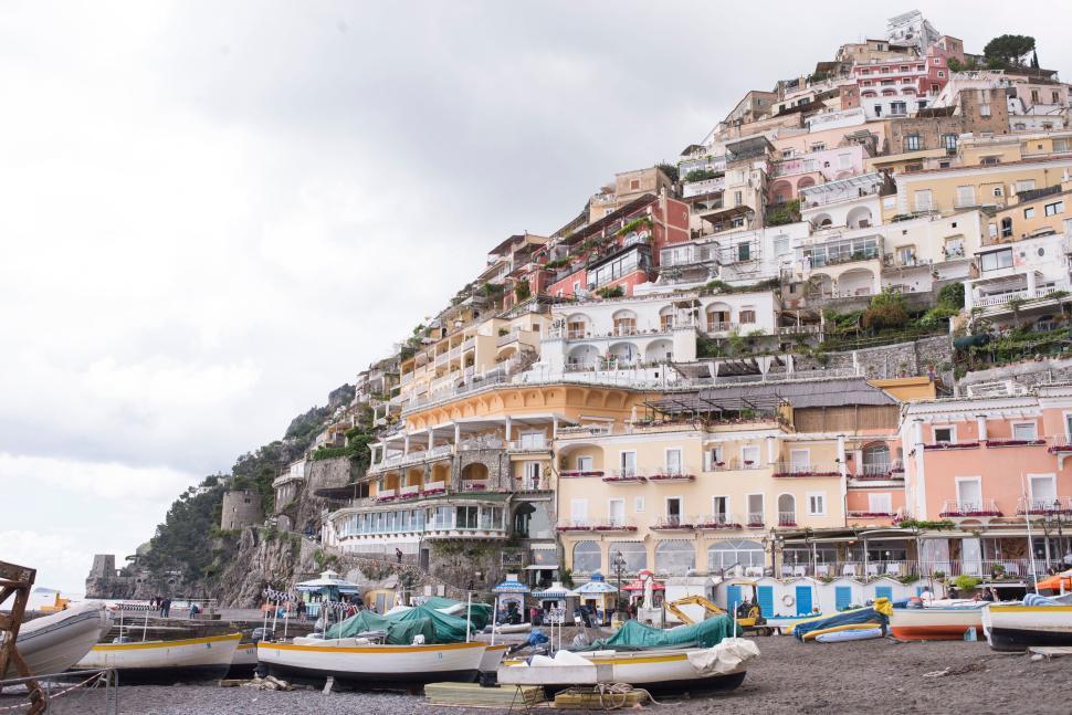 Free Image of Hillside view of Positano, with colorful buildings and boats 