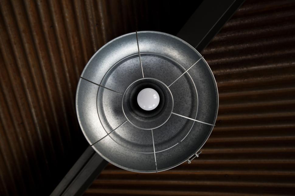 Free Image of Industrial light fixture with rustic corrugated ceiling. 