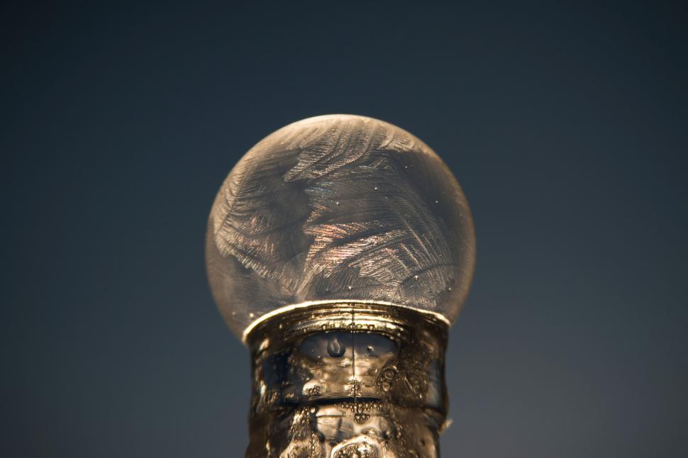 Free Image of Close-up of ornate lamp’s frosted glass globe 
