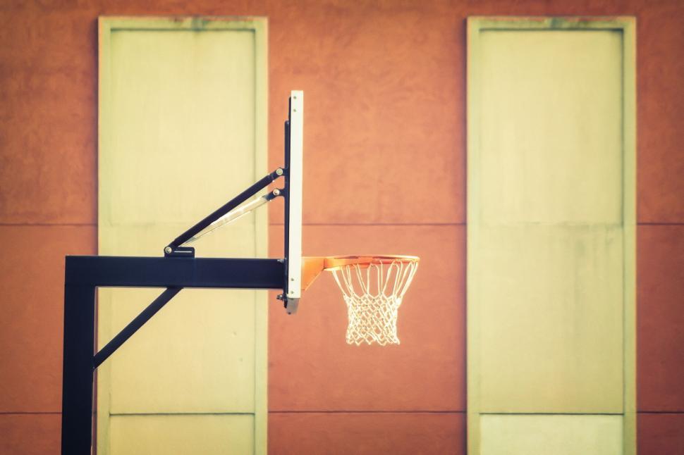 Free Image of A basketball hoop attached to a black metal pole. 