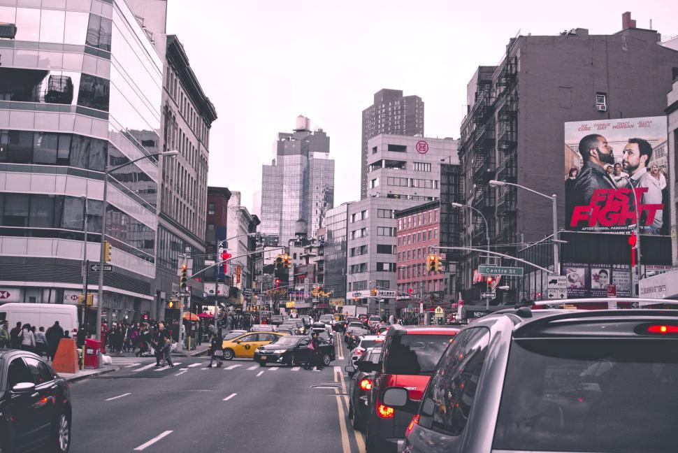 Free Image of City street bustling with traffic and dynamic advertisements. 
