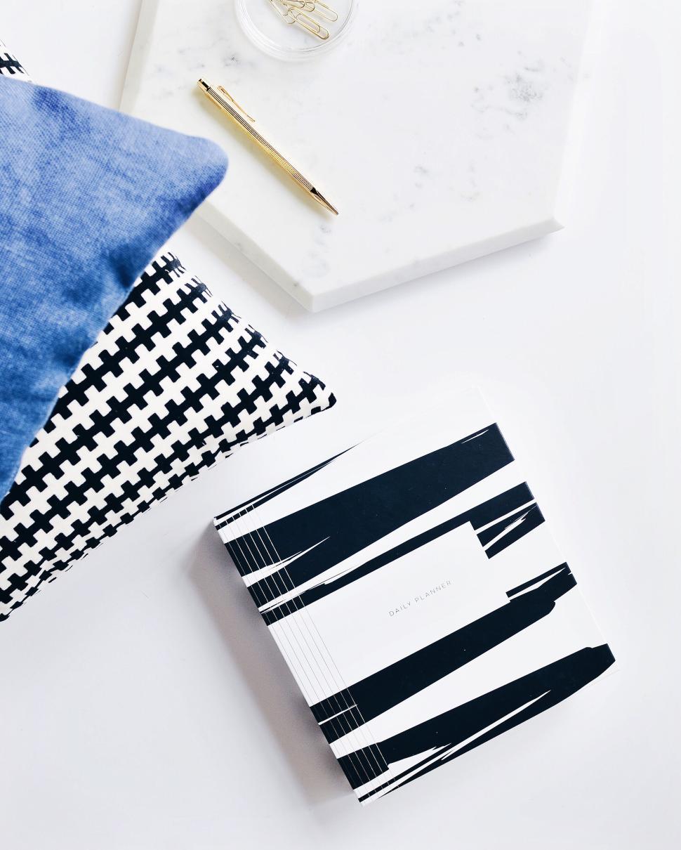 Free Image of Monochrome notebook and pillows, artistic flatlay. 