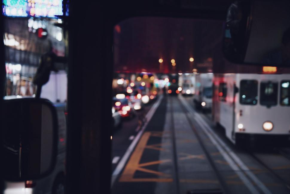 Free Image of Evening traffic scene with buses and cars in motion. 