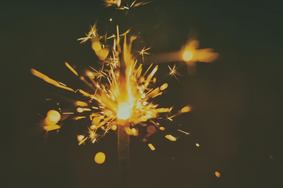 Free Image of Illuminated sparkler burning with glowing sparks. 