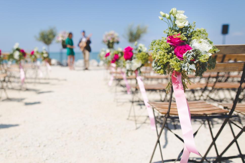 Free Image of Outdoor wedding ceremony setup with floral decorations 