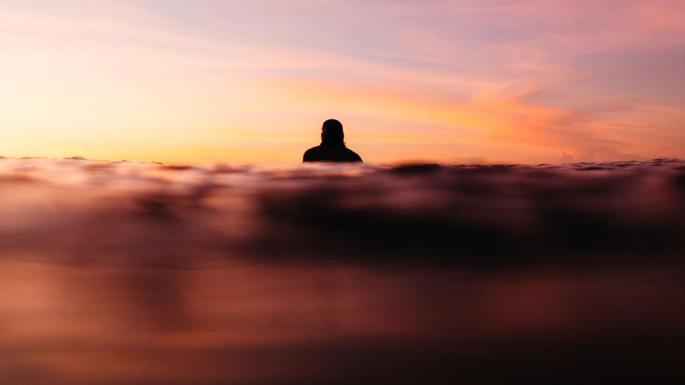 https://freerangestock.com/sample/184617/silhouette-of-person-in-water-during-sunset..jpg