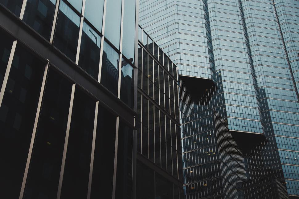 Free Image of Modern glass skyscrapers against a clear sky background 