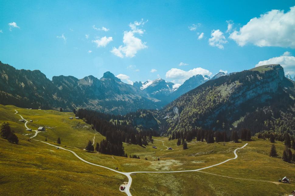 Free Image of Stunning mountainous landscape with winding paths view. 