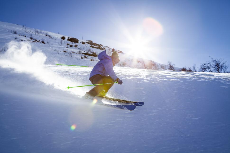 Free Image of A skier making swift moves on a snowy slope. 