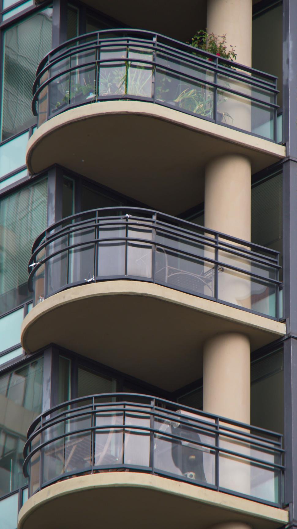 Free Image of Residential building with multiple balconies and plants 