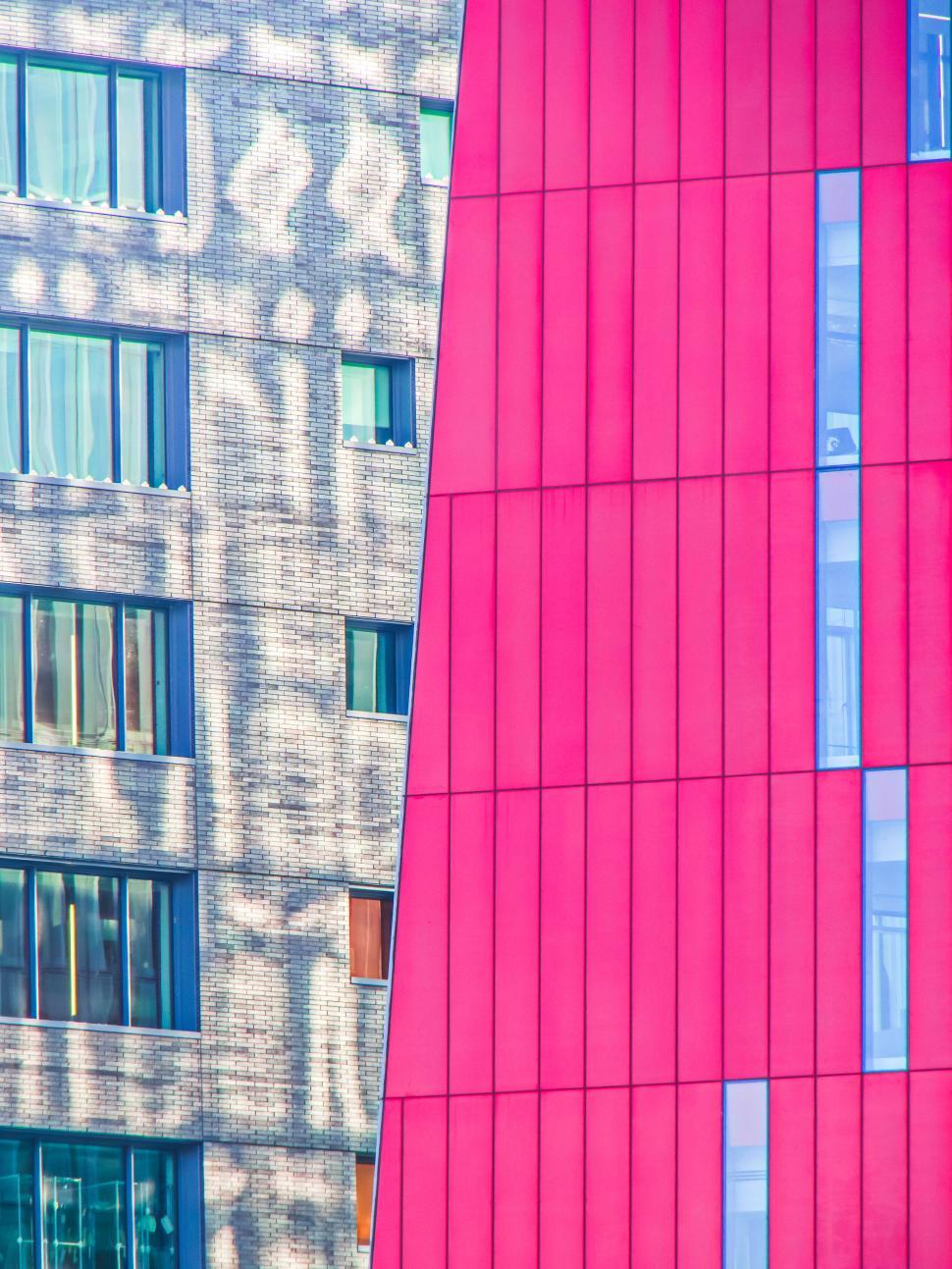 Free Image of Contrasting colorful facades of modern buildings view. 