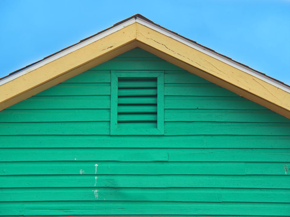 Free Image of Colorful house with green wall and vivid blue sky 