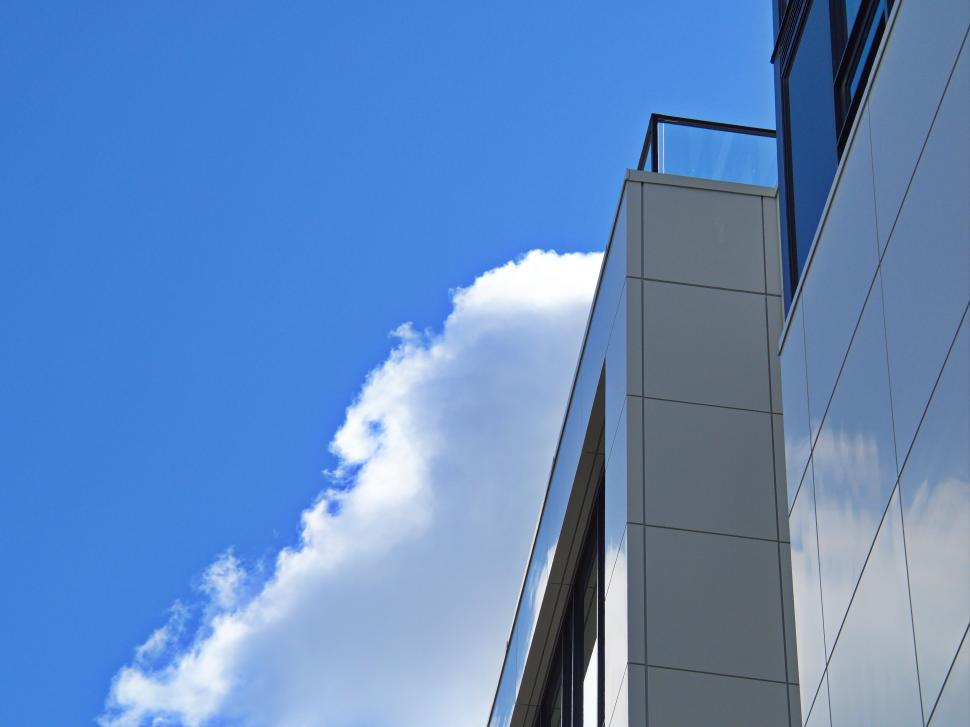Free Image of Corner view of modern building against blue sky. 